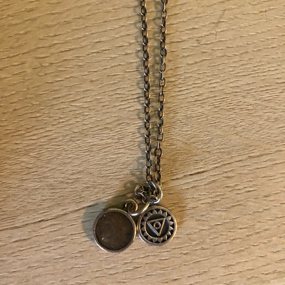 Sterling silver necklace with throat chakra charm.